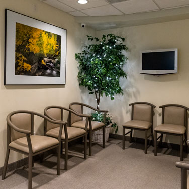 Corner of our waiting room at Nancy Shiba, DDS featuring multiple chairs for patients to wait comfortably in.