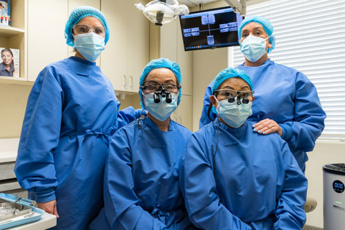 Dr.Shiba and team member are in operation gown and mask up.